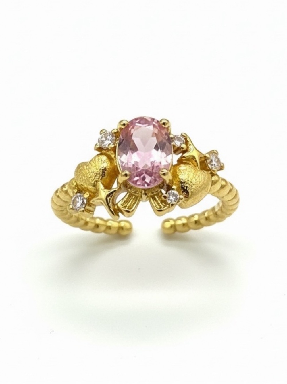 Gold Ring with bow and little hearts and a center pink gemstone